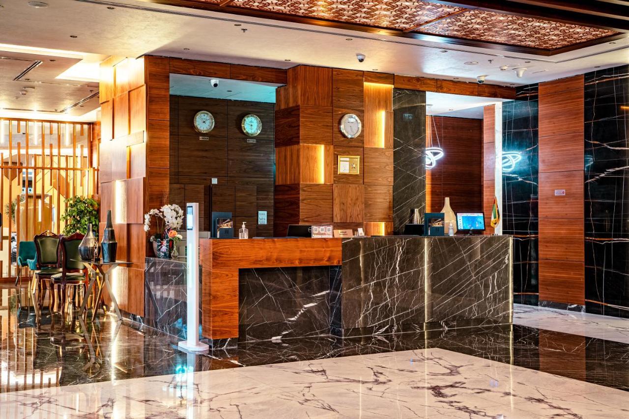 שארג'ה Luxe Grand Hotel Apartments מראה חיצוני תמונה The lobby of the hotel