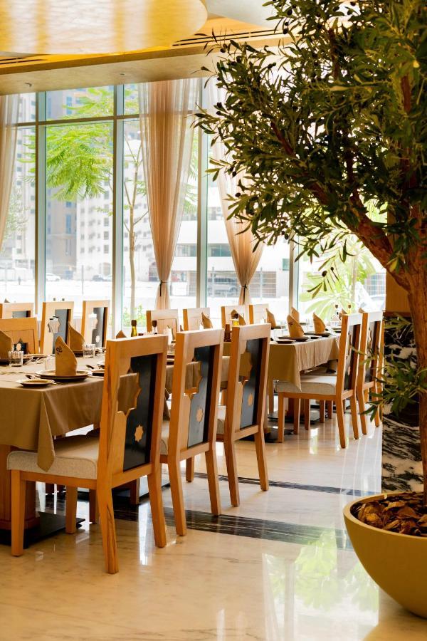 שארג'ה Luxe Grand Hotel Apartments מראה חיצוני תמונה Restaurant